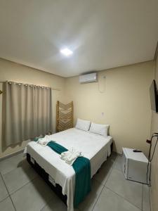 Cama ou camas em um quarto em Pousada Vista da Serra - Suzart
