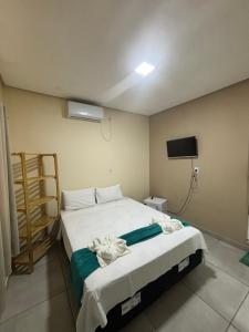 Cama ou camas em um quarto em Pousada Vista da Serra - Suzart