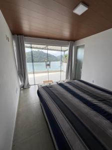 En eller flere senge i et værelse på Casa Bela Vista