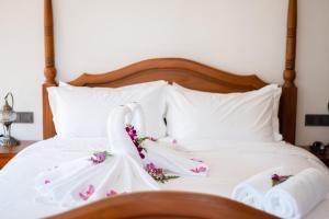 Ліжко або ліжка в номері Lanna Inthan Resort
