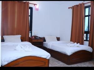 Hotel Siddhartha in Lumbini客房内的一张或多张床位