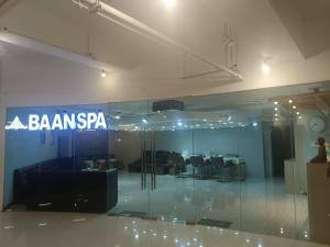an office with a glass wall with a sign that reads bannspapa at Mactan Newtown Studio Unit Near Airport in Punta Engaño +15 photos
