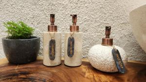 a group of three bottles sitting on top of a table at Thousand Sunday Ubud in Ubud