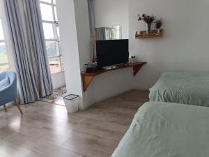 TV a/nebo společenská místnost v ubytování Jacky's Guesthouse
