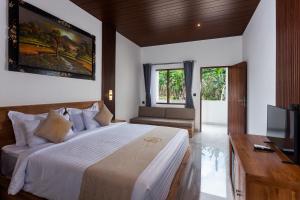 TV a/nebo společenská místnost v ubytování Sujiwa Ubud Hotel & Villa