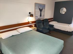Postel nebo postele na pokoji v ubytování Shelly Beach Motel