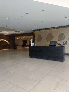a lobby with a reception desk in a building at Exec 1BR One Manchester Place with pool, beach pass is P 350 pp in Punta Engaño +40 photos