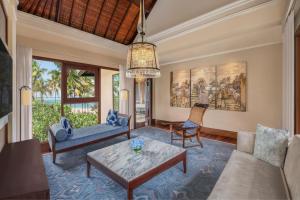 a living room with a couch and a table at The St. Regis Bali Resort in Nusa Dua
