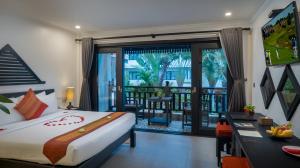 a bedroom with a bed and a balcony at Khmer Mansion Boutique Hotel in Siem Reap +74 photos