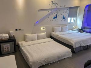 Postel nebo postele na pokoji v ubytování Galaxia Business Hotel