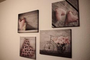a group of pictures hanging on a wall at Apartments in Bern - Breitenrainplatz in Bern