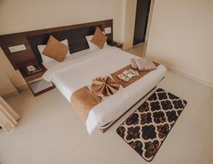 Postel nebo postele na pokoji v ubytování Hotel Mahabaleshwar Mount View