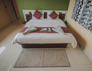 Postel nebo postele na pokoji v ubytování Hotel Mahabaleshwar Mount View