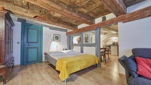 a bedroom with a bed and a blue door at Altstadt Apartments in Lüneburg