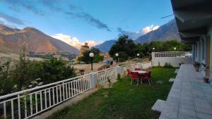 a balcony of a house with a view of mountains at Fort View Hotel near Altit fort, Hunza in Hunza