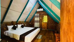 a bedroom with a bed in a room at Ali Adi Eco Tree House in Sigiriya +66 photos
