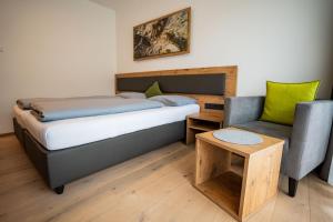 Ένα ή περισσότερα κρεβάτια σε δωμάτιο στο Hotel Garni Isarlodge Wiesenhof