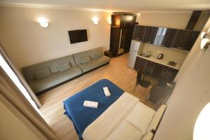 a living room with a couch and a table in a room at BATUMi SEA TOWERS SEA VIEW 15 G in Angisa