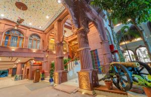 a large building with a wheel in the middle at The Kurki Heritage in Jaipur