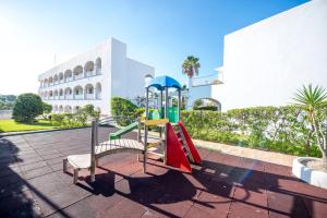 a playground in front of a building at Ona Village Cala d'Or in Cala d´Or