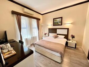Postel nebo postele na pokoji v ubytování Çimenler otel