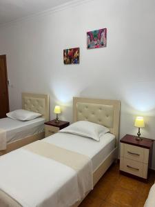 Voodi või voodid majutusasutuse Hotel Kalaja toas