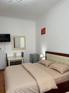 Voodi või voodid majutusasutuse Hotel Kalaja toas