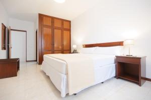 Cama ou camas em um quarto em Hotel Central Santa Maria
