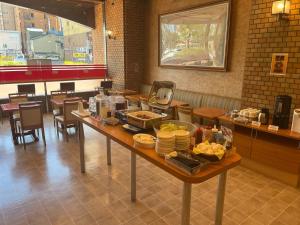 a table with food on it in a restaurant at Hotel Axia Inn Kushiro - Vacation STAY 67227v in Irifunechō