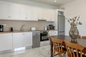 A kitchen or kitchenette at Pano Stalos Villas