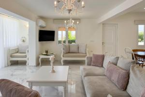 A television and/or entertainment centre at Pano Stalos Villas