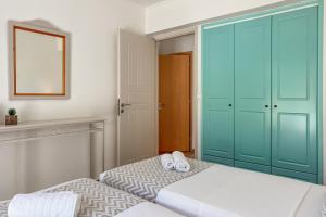 A bed or beds in a room at Pano Stalos Villas