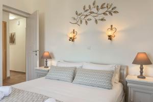 A bed or beds in a room at Pano Stalos Villas
