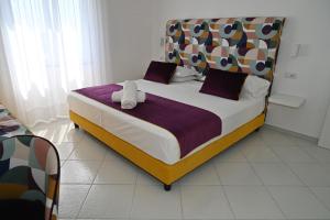 a bedroom with a large bed in a room at Gala Residence Villa Giovanna in Ravello