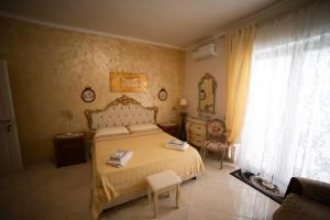 a bedroom with a bed and a dresser and a window at Duchessa Katia Accomodation Tropea in Tropea