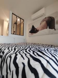 En eller flere senge i et værelse på Au 69 du Village Naturiste