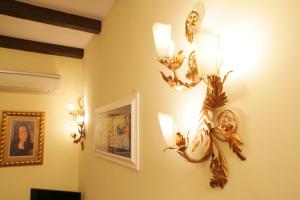 a room with two lights on the wall at Navona Little Home in Rome