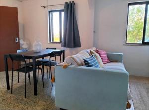 a living room with a couch and a table at Country House Silves in Silves