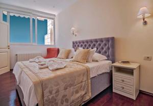 Postel nebo postele na pokoji v ubytování Apartments Draga