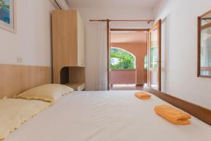 Posteľ alebo postele v izbe v ubytovaní Apartments Ruze