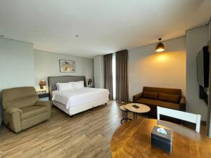 Postel nebo postele na pokoji v ubytování Arrayan Hotel Malioboro