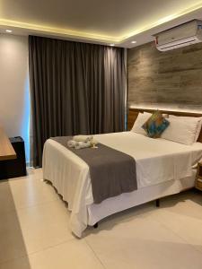 Postel nebo postele na pokoji v ubytování Hotel Pousada Casacolina