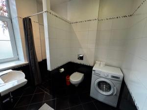 Koupelna v ubytování ApartHotel Riga