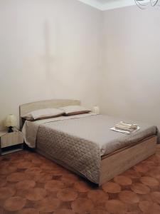 Postel nebo postele na pokoji v ubytování La Divina guest house