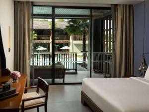 Avista Hideaway Phuket Patong - MGallery客房内的一张或多张床位