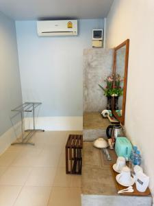 a room with a counter with a mirror and a sink at Andawa Lanta Resort in Ko Lanta
