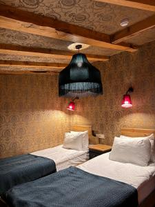 Postel nebo postele na pokoji v ubytování Hotel Memoire Kutaisi