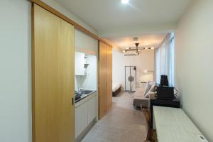 a room with a kitchen and a living room at Hotel AIRSTAR in Fukuoka