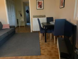 a living room with a table and a couch at Cap d Antibes, Salis beach , 2 bedrooms , free parking in Antibes