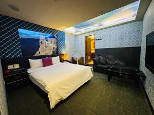 TV a/nebo společenská místnost v ubytování Wecity Hotel 薇城精緻旅店 + 15 fotografií
